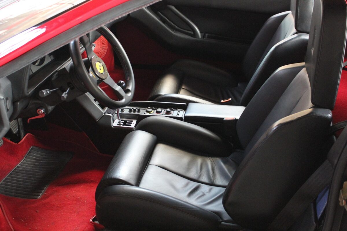 Three child seats installed across a car back seat