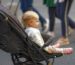 Infant car seat clicking into a stroller frame